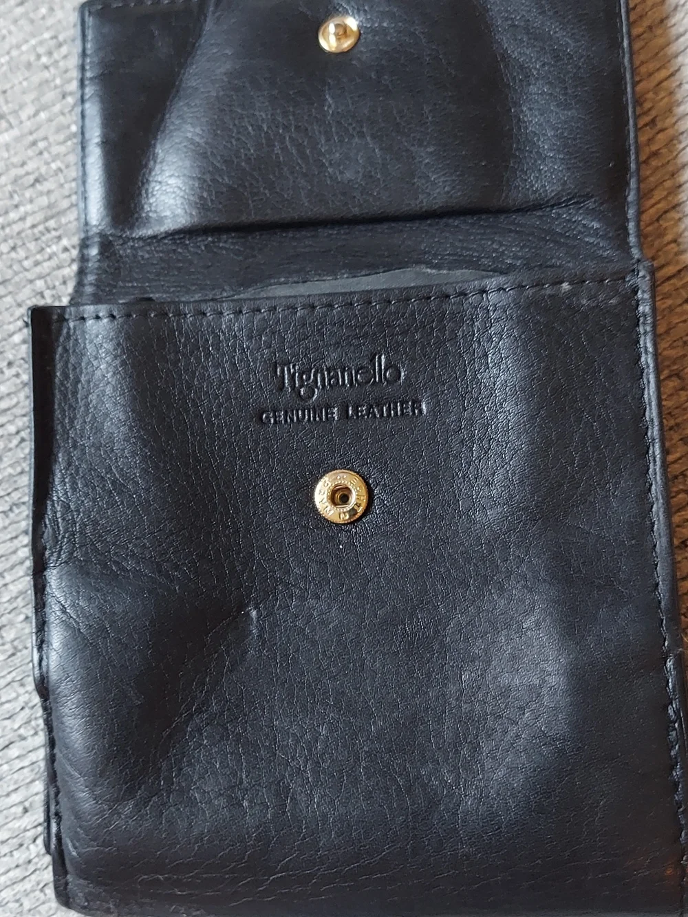 Tignanello Black Leather Bi-Fold Wallet with Gold Plaque